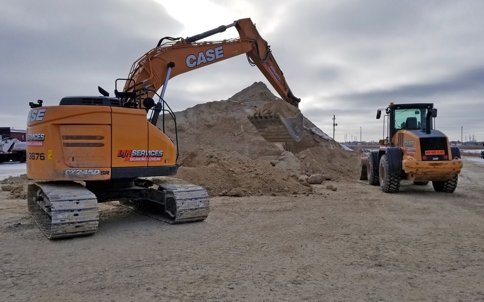 DJN excavator and wheel loader on a Winnipeg site