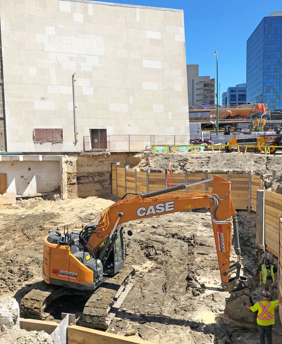 DJN excavator in a shored downtown excavation
